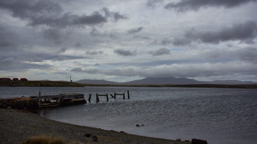An old jetty at Darwin in the Falkland islands with Mt usborne in the distance